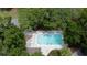 Refreshing community pool surrounded by lush trees, perfect for relaxation at 268 Little Oak Island Dr, Folly Beach, SC 29439