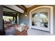 Inviting porch with wicker chair and double doors leading into the home at 268 Little Oak Island Dr, Folly Beach, SC 29439