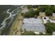 Aerial view of two tennis and pickleball courts near a waterway at 268 Little Oak Island Dr, Folly Beach, SC 29439