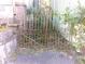 Rusty ornate iron gate in need of repair at 5 President Pl, Charleston, SC 29403