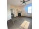 Damaged living room with hardwood floors and fireplace at 5 President Pl, Charleston, SC 29403