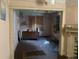 Damaged living room with hardwood floors and fireplace at 5 President Pl, Charleston, SC 29403