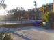 Residential street view with chain link fence and parked cars at 5 President Pl, Charleston, SC 29403