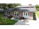 Brick ranch house with gray roof, white door, and landscaped yard at 114 Berkeley Cir, Summerville, SC 29483