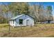 White house with green trim, situated on a grassy lot with trees in the background at 0 Gum Branch Rd, Saint George, SC 29477