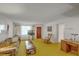 Living room with vintage furniture and yellow carpet at 1447 Fort Lamar Rd, Charleston, SC 29412