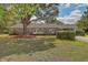 Brick ranch house with large tree in front at 1447 Fort Lamar Rd, Charleston, SC 29412