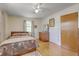 Bright bedroom with wood floors, a double bed, and vintage dresser at 1447 Fort Lamar Rd, Charleston, SC 29412