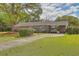 Brick ranch house with carport and driveway at 1447 Fort Lamar Rd, Charleston, SC 29412
