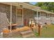 Side porch with tiled flooring and brick walls at 1447 Fort Lamar Rd, Charleston, SC 29412