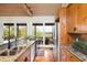 Modern kitchen with granite countertops and stainless steel appliances at 154 Lake Timicau Ln, Dewees Island, SC 29451