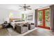 Guest bedroom with two armchairs and private balcony at 3115 Ion Ave # C, Sullivans Island, SC 29482