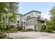 Contemporary gray house with large windows and a spacious driveway at 3115 Ion Ave # B, Sullivans Island, SC 29482