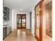 Elegant wine cellar with glass doors and built-in wooden racks at 3115 Ion Ave # B, Sullivans Island, SC 29482
