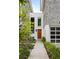 Modern home exterior with walkway leading to a wood front door and attached garage at 3115 Ion Ave # B, Sullivans Island, SC 29482