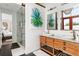 Elegant bathroom with double sinks, a large walk-in shower, and wooden vanity at 3115 Ion Ave # B, Sullivans Island, SC 29482