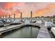 Wooden docks with boats and calm water at sunset at 1880 Andell Bluff Blvd # D-16, Seabrook Island, SC 29455