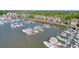 Aerial view of a marina with numerous boats and waterfront properties at 1880 Andell Bluff Blvd # D-16, Seabrook Island, SC 29455