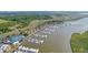 Drone view of a full-service marina, boat slips, and waterfront homes at 1880 Andell Bluff Blvd # D-16, Seabrook Island, SC 29455