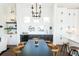 Bright dining area with a dark wood table and modern chandelier at 516 Hayes Park Blvd # 1, Johns Island, SC 29455