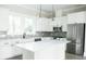 Modern kitchen with white cabinetry, large island, and stainless steel appliances at 516 Hayes Park Blvd # 1, Johns Island, SC 29455
