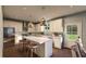 Modern kitchen with island, white cabinets, and stainless steel appliances at 516 Hayes Park Blvd # 1, Johns Island, SC 29455
