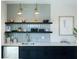 Modern wet bar with gray tile backsplash, floating shelves, and quartz countertops at 516 Hayes Park Blvd # 1, Johns Island, SC 29455