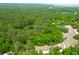 Aerial view of a wooded lot with a pond at 714 Wilson Cemetery Rd, Awendaw, SC 29429