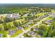 Aerial view of a beautiful neighborhood with lush landscaping and a golf course at 301 Flowering Peach # 203, Charleston, SC 29414