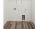 Laundry room with vinyl flooring and hookups for washer and dryer at 301 Flowering Peach # 203, Charleston, SC 29414