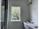 Bathroom with a window, grey vanity, and quartz countertop at 200 Saunter Ct # 30, Johns Island, SC 29455