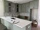 Spacious kitchen with green cabinets, quartz countertops, and stainless steel sink at 200 Saunter Ct # 30, Johns Island, SC 29455