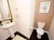 Powder room with pedestal sink, updated fixtures, and decorative wallpaper at 420 Eagleview Dr, Moncks Corner, SC 29461