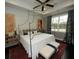 Main bedroom with a canopy bed, hardwood floors, and large windows at 420 Eagleview Dr, Moncks Corner, SC 29461