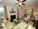 Open living space with a fireplace, large windows, and hardwood floors at 420 Eagleview Dr, Moncks Corner, SC 29461