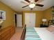 Bright bedroom with mustard-yellow walls, double closet, and metal bed frame at 420 Eagleview Dr, Moncks Corner, SC 29461