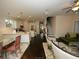 Open concept kitchen and living area with hardwood floors and island at 420 Eagleview Dr, Moncks Corner, SC 29461
