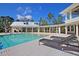 Inviting pool with lounge chairs and clubhouse at 130 Peninsula Dr, Ravenel, SC 29470