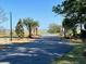Waterfront community entrance with lush landscaping at 1075 Capersview Ct, Awendaw, SC 29429