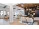 Open concept living room and kitchen with wood beams, built-in shelving, and hardwood floors at 615 Faulkner Dr, Mount Pleasant, SC 29466