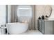 Spa-like bathroom with a large soaking tub and marble tile at 615 Faulkner Dr, Mount Pleasant, SC 29466