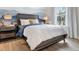 Charming bedroom with a striped comforter and wood-look floors at 615 Faulkner Dr, Mount Pleasant, SC 29466