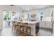 Modern kitchen with white cabinets, marble backsplash, and large island with seating at 615 Faulkner Dr, Mount Pleasant, SC 29466