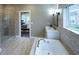 Spa-like bathroom with soaking tub, walk-in shower, and double vanity at 639 Faulkner Dr, Mount Pleasant, SC 29466