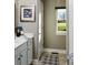 Bright bathroom with double vanity and view to backyard at 639 Faulkner Dr, Mount Pleasant, SC 29466