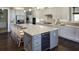 Modern kitchen boasts a large island with wine cooler and stainless steel appliances at 639 Faulkner Dr, Mount Pleasant, SC 29466