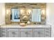 Bathroom with a double vanity, modern lighting, and stylish tile work at 635 Faulkner Dr, Mount Pleasant, SC 29466