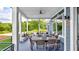 Relaxing covered porch with outdoor seating and wooded views at 635 Faulkner Dr, Mount Pleasant, SC 29466