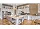 Modern kitchen with white cabinets, stainless steel appliances, and a large island at 635 Faulkner Dr, Mount Pleasant, SC 29466