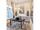 Home office with built-in cabinets, hardwood floors, and a large window at 635 Faulkner Dr, Mount Pleasant, SC 29466